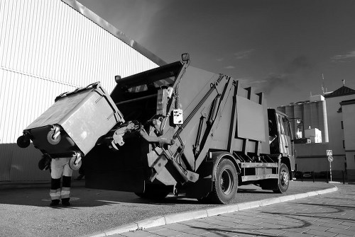 Professional team performing office clearance in a modern South London office