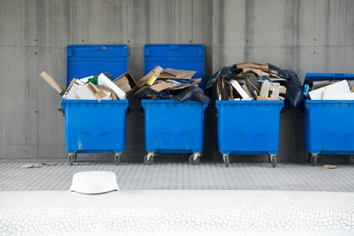 Recycling bins and sorting materials in an office environment