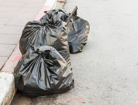 Waste collection workers sorting recyclables