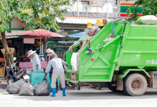 Residents arranging furniture for disposal in South London